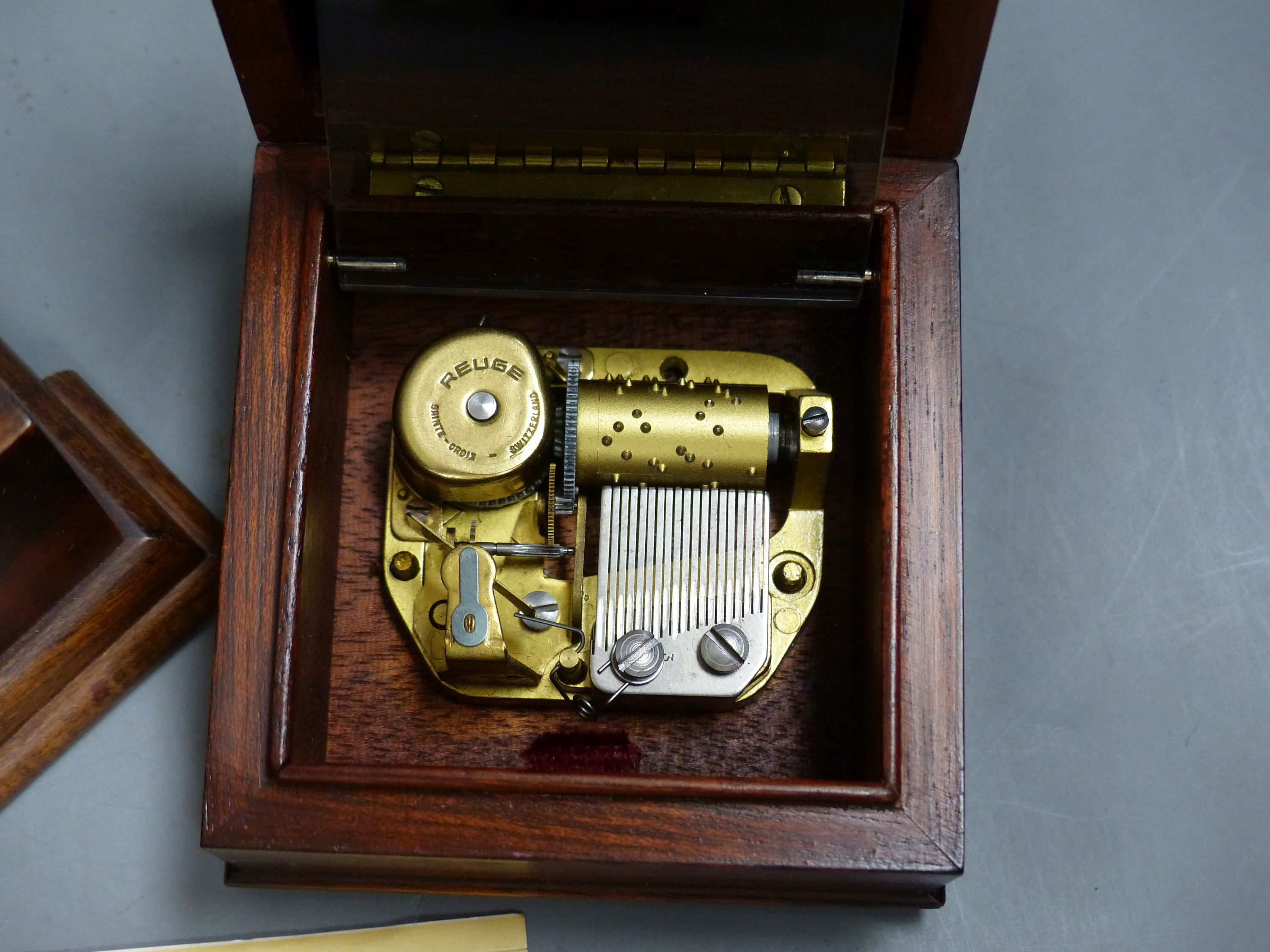 A Swiss Reuge St Croix marquetry and walnut cylinder music box, playing 'The Four Seasons' and a similar small square music box